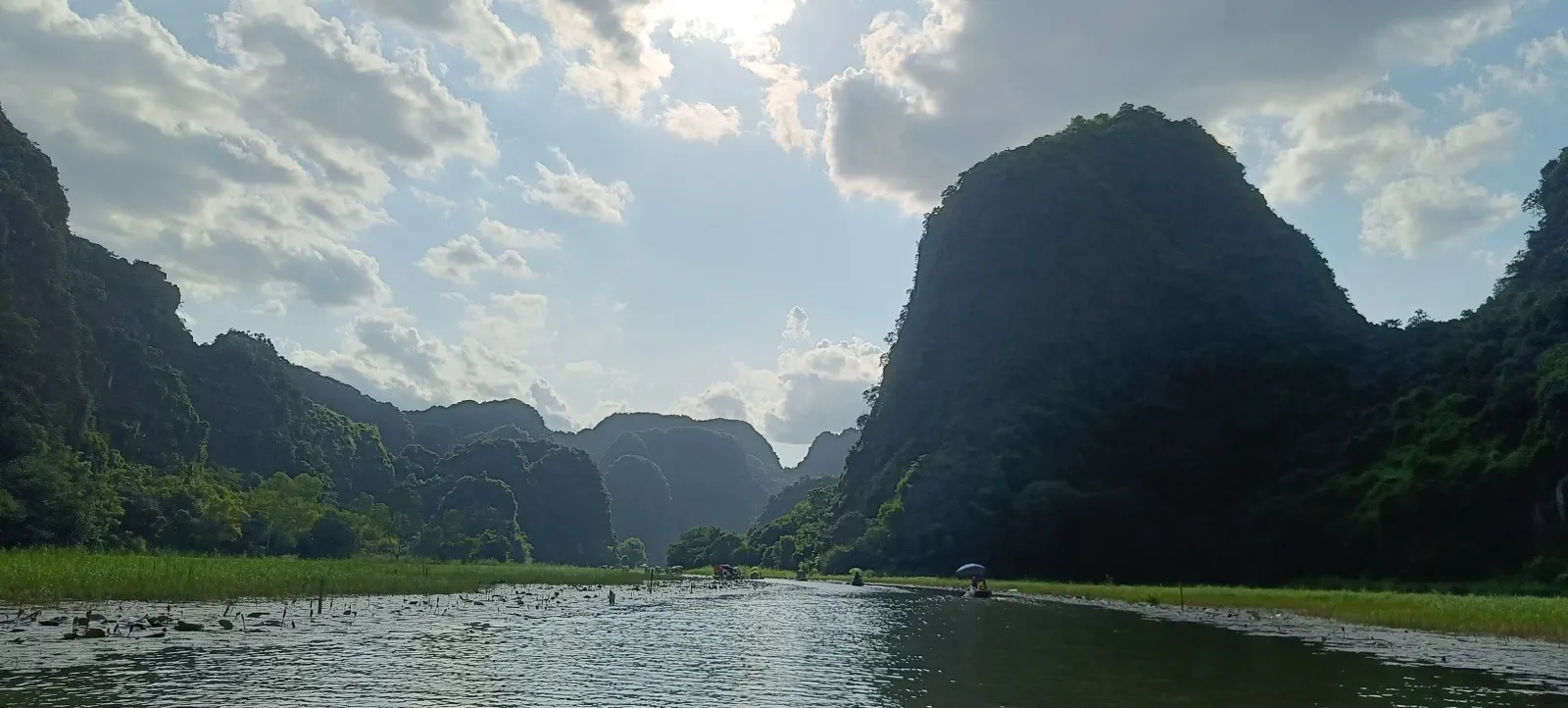 Limestone karsts rising over the Tam Coc river in Ninh Binh